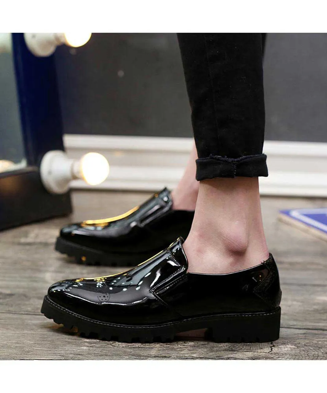 Black brogue patent leather slip on dress shoe