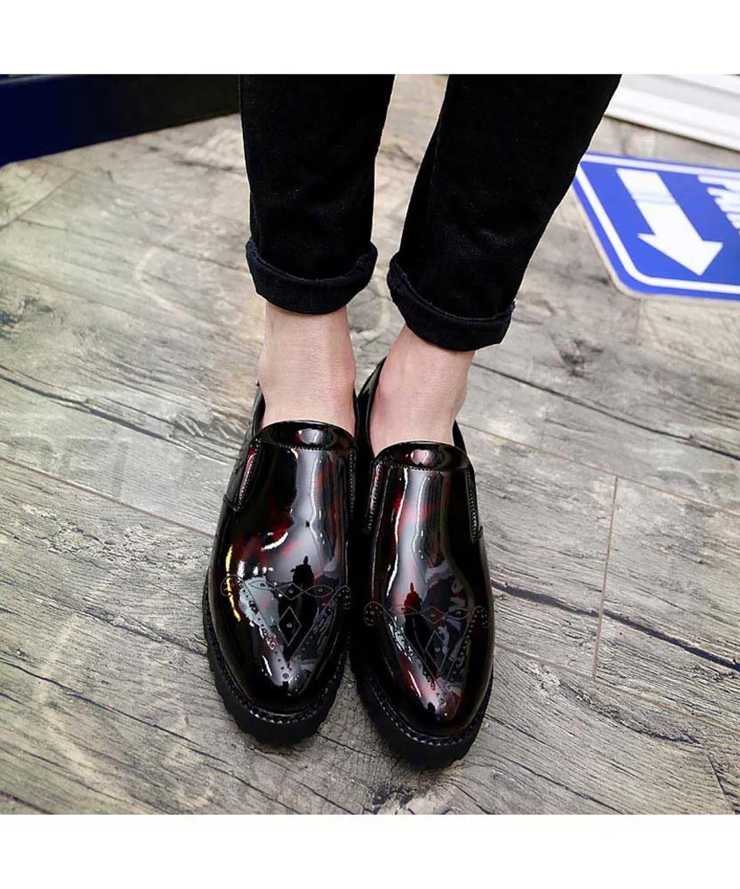 Red brogue patent leather slip on dress shoe