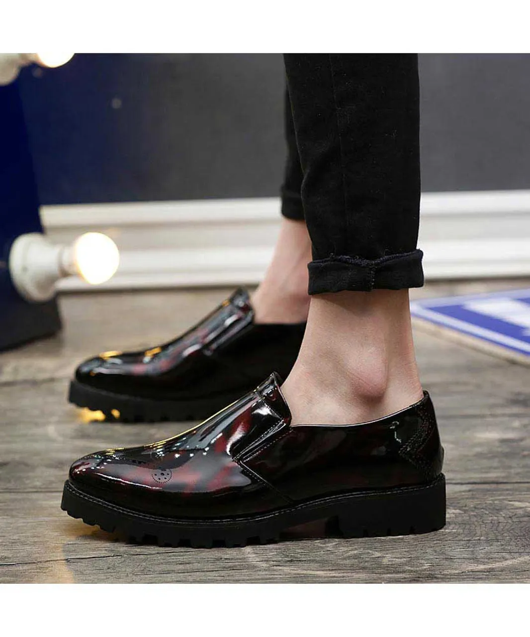 Red brogue patent leather slip on dress shoe